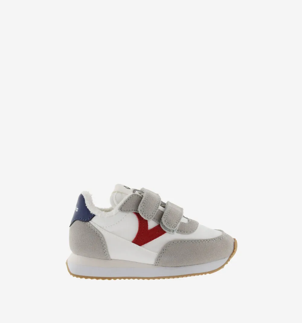 Astro jogger style sneakers with red V and blue heel